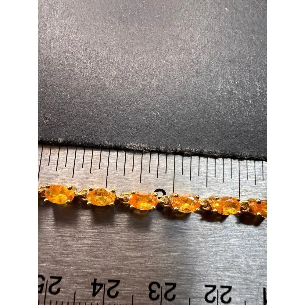 Yellow spessartine garnet tennis bracelet in gold over sterling silver